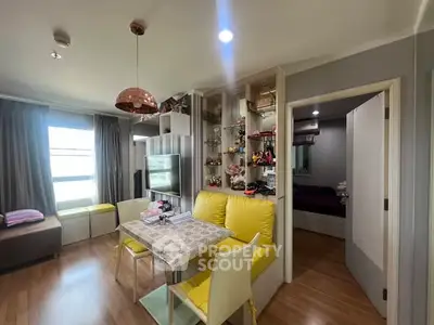 Charming living room with modern decor and cozy dining area in a stylish apartment.