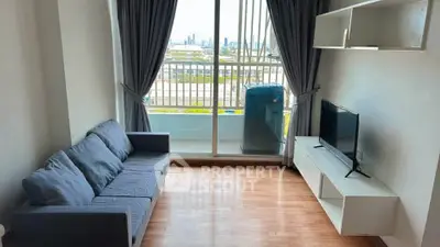Modern living room with balcony view and sleek furniture