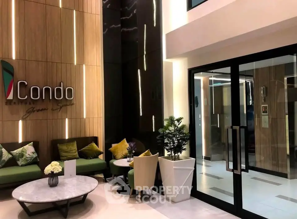 Luxurious condo entrance with modern seating and elegant decor