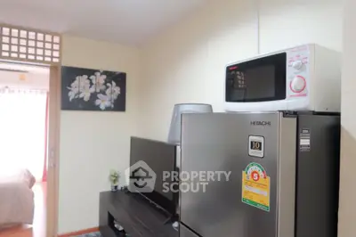 Cozy living area with modern appliances and stylish decor