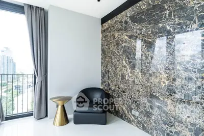 Luxurious modern interior with marble accent wall and city view balcony