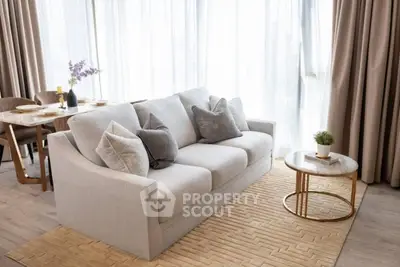 Elegant living room with plush sofa and stylish decor in modern apartment