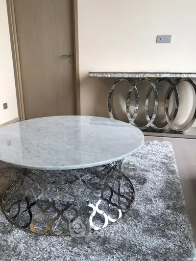 Elegant modern living room with stylish marble and metal furniture