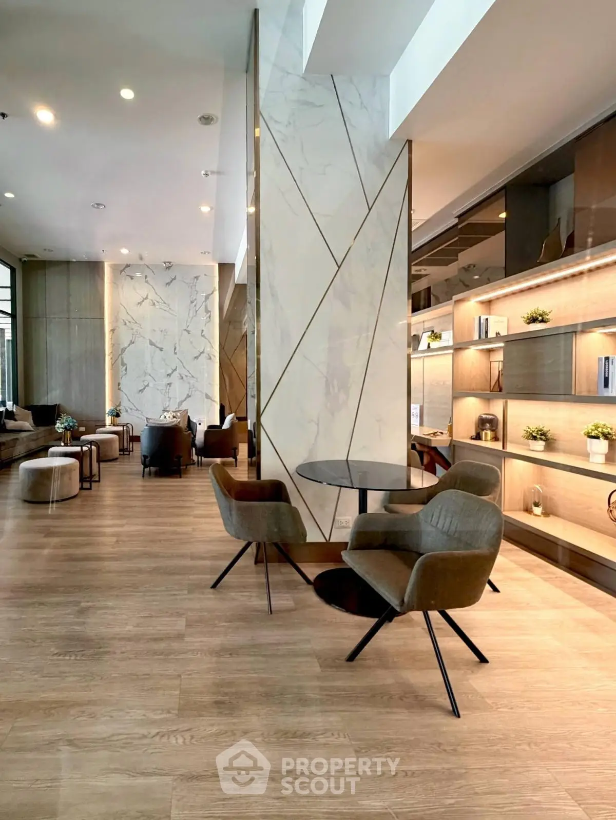 Luxurious modern lobby with elegant seating and stylish decor, perfect for welcoming guests in a high-end building.
