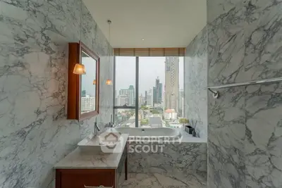 Luxurious marble bathroom with city view and elegant fixtures