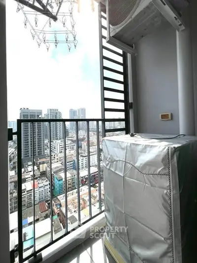 High-rise balcony with cityscape view and air conditioning unit, perfect for urban living.