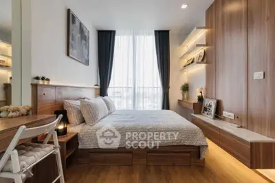 Modern bedroom with wooden accents and large window offering natural light.