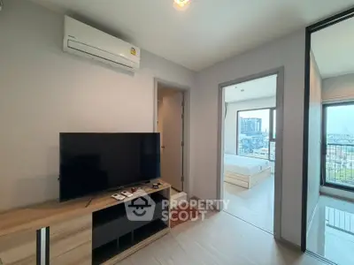 Modern apartment interior with TV and city view from bedroom