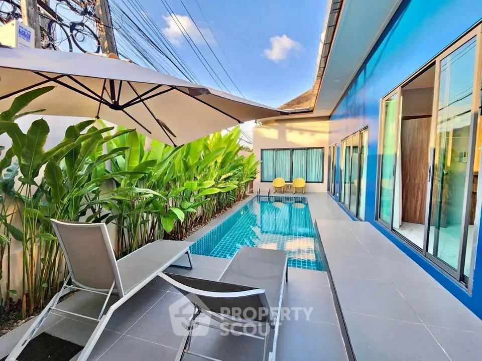 Luxurious private pool area with modern design and lush greenery