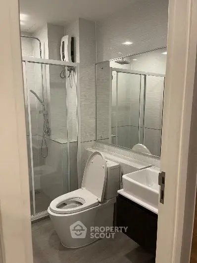 Modern bathroom with glass shower and sleek fixtures