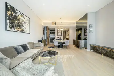 Luxurious open-plan living room with elegant decor and modern kitchen