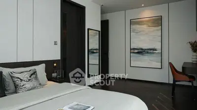 Modern bedroom with elegant decor and stylish artwork