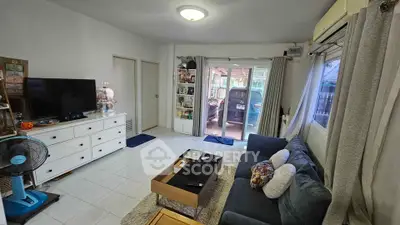 Cozy living room with modern decor and large window view