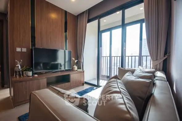 Modern living room with large windows and balcony view in luxury apartment.