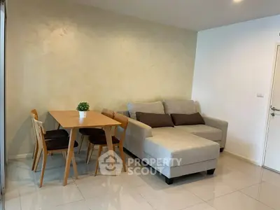Modern living room with cozy sofa and dining table in stylish apartment