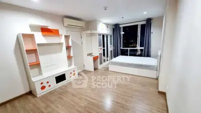 Modern bedroom with stylish built-in furniture and city view window