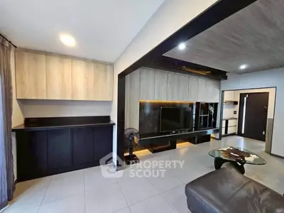 Modern living room with sleek built-in cabinets and stylish TV unit, perfect for contemporary living.