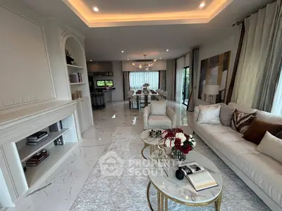 Luxurious open-plan living room with elegant decor and modern furnishings