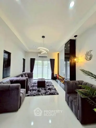 Luxurious modern living room with plush sofas and elegant lighting