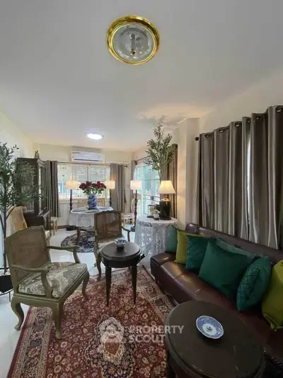 Charming living room with elegant decor and cozy seating area, perfect for relaxation.