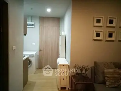 Cozy apartment interior with washing machine and stylish decor.