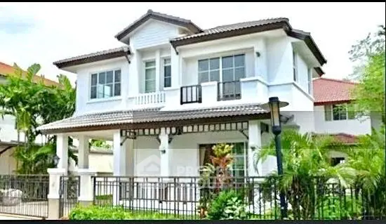 Stunning two-story house with lush garden and modern design, perfect for family living.