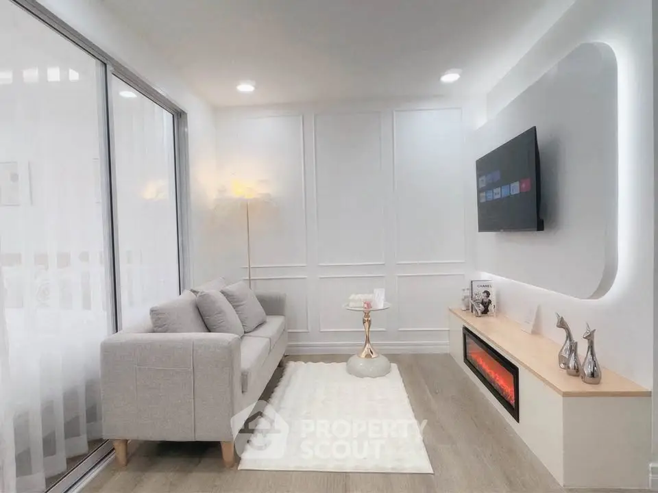 Modern living room with sleek design, featuring a cozy sofa, wall-mounted TV, and elegant fireplace.