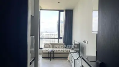 Modern apartment living room with large window and city view