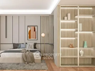 Modern bedroom with stylish decor and built-in shelving, featuring cozy lighting and contemporary artwork.