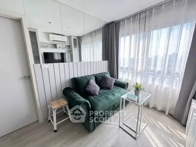 Chic modern living room with plush green sofa and panoramic city view
