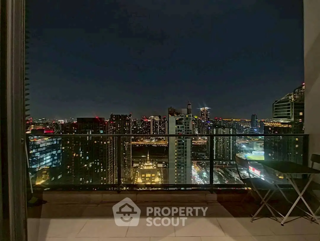 Stunning city skyline view from a modern balcony at night, perfect for urban living.