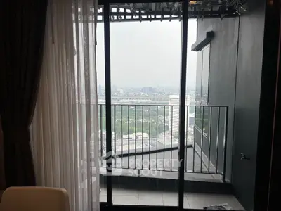 Stunning high-rise balcony with panoramic city view, perfect for urban living enthusiasts.