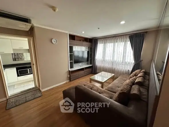 Cozy living room with modern decor and open kitchen view