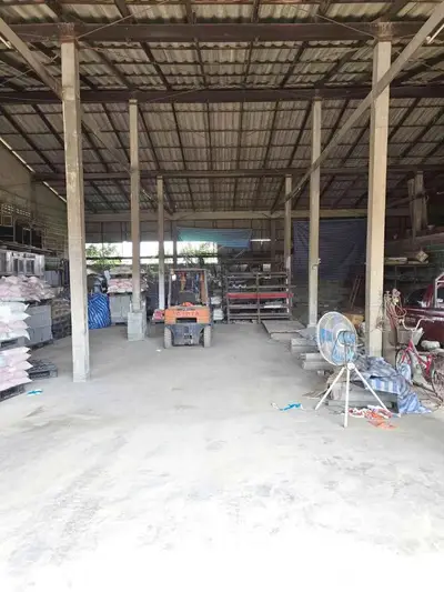 Spacious industrial warehouse with high ceilings and ample storage space.