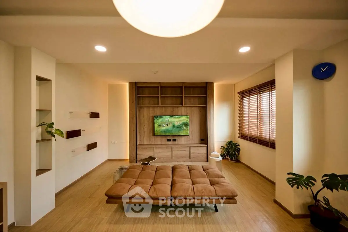 Spacious modern living room with stylish decor and natural light