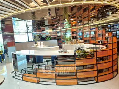 Modern kitchen with sleek design and open layout, featuring stylish countertops and vibrant decor.