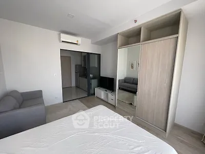 Modern studio apartment with sleek design and built-in wardrobe