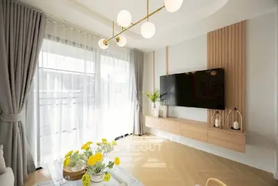 Elegant living room with modern decor and large windows