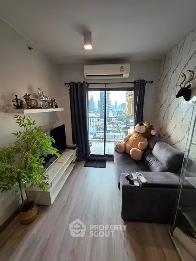 Modern living room with city view, stylish decor, and cozy seating area.