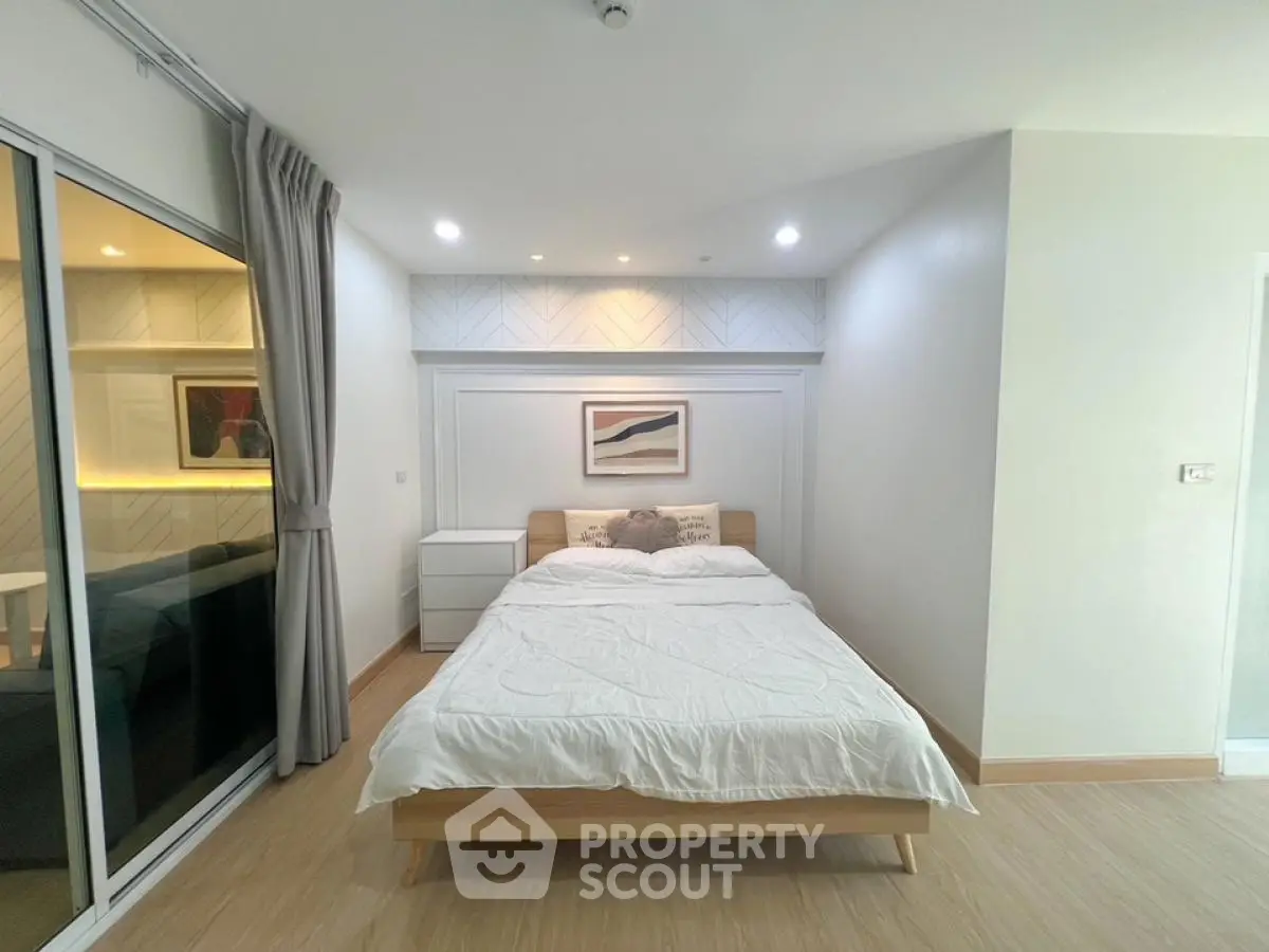 Modern bedroom with cozy bed and stylish decor in a bright apartment