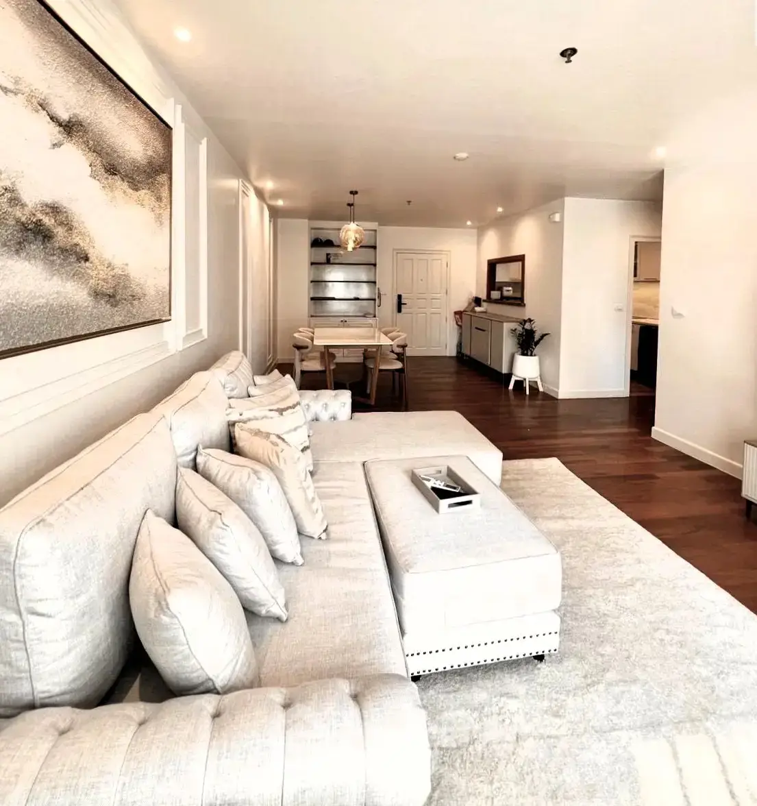 Spacious modern living room with elegant decor and open layout, perfect for entertaining.