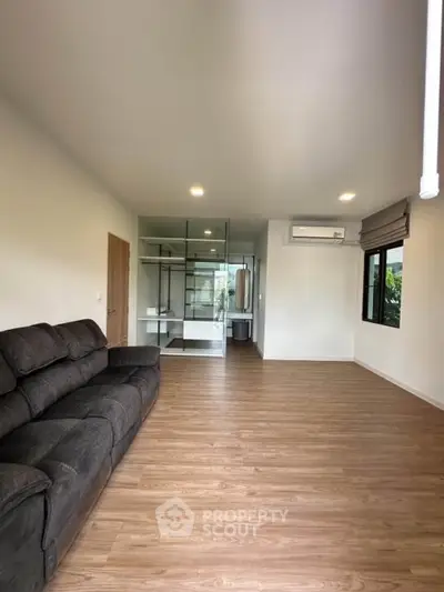 Spacious living room with modern design and wooden flooring
