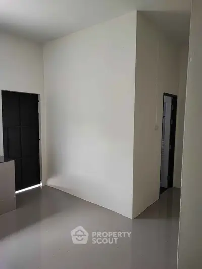 Minimalist interior space with sleek flooring and modern design