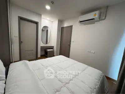 Modern bedroom with air conditioning and minimalist decor