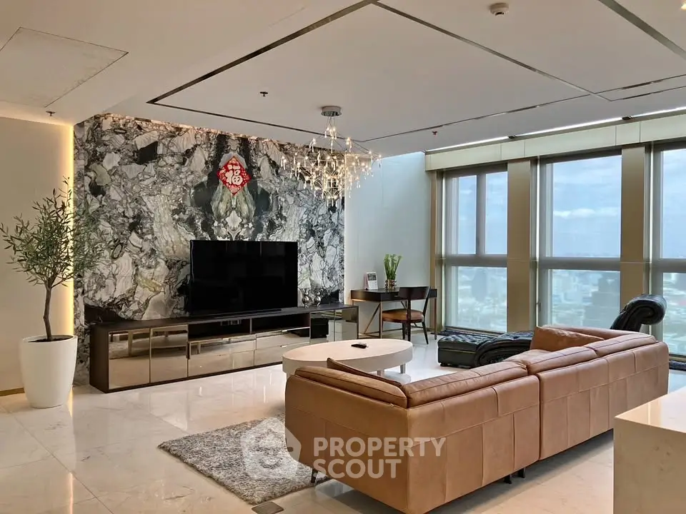 Luxurious living room with panoramic city views, elegant decor, and modern furnishings in a high-rise apartment.