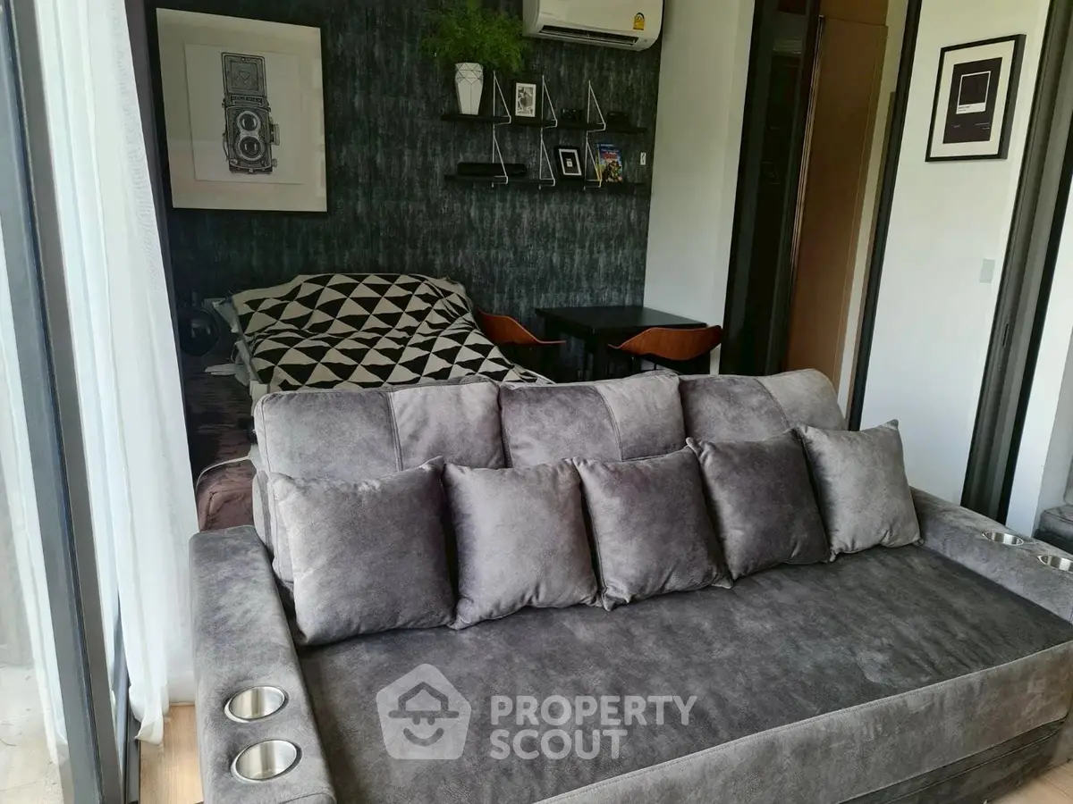 Modern living room with stylish decor and cozy seating in a contemporary apartment.