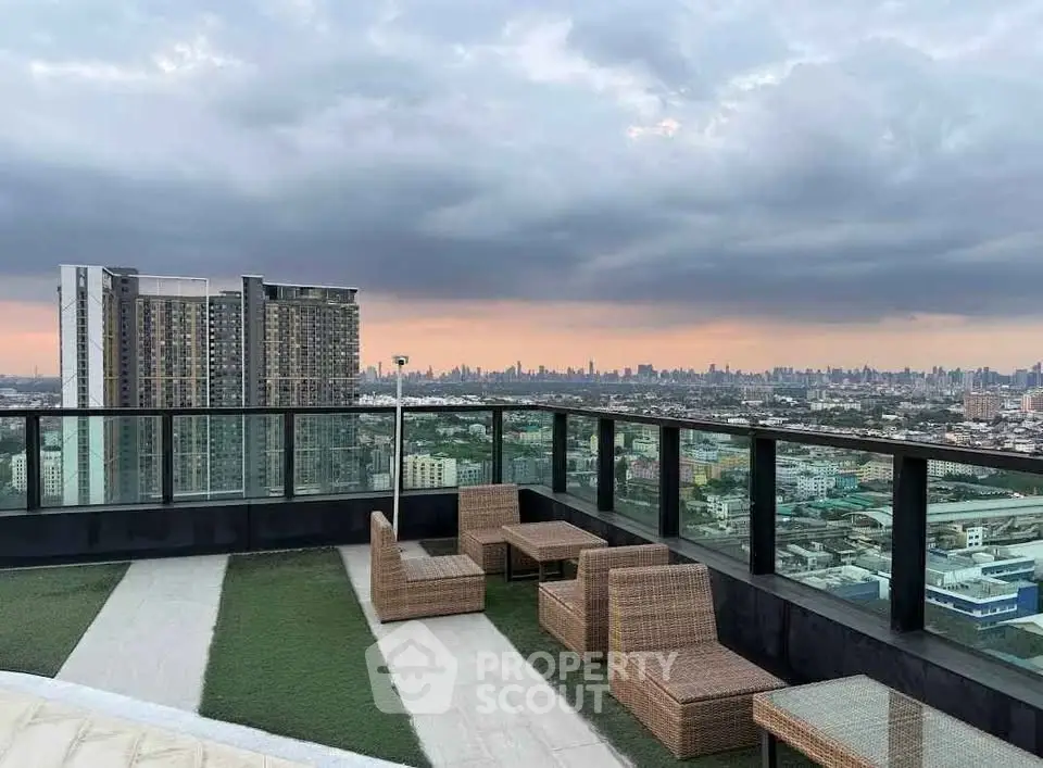 Stunning rooftop view with modern outdoor seating and city skyline backdrop.