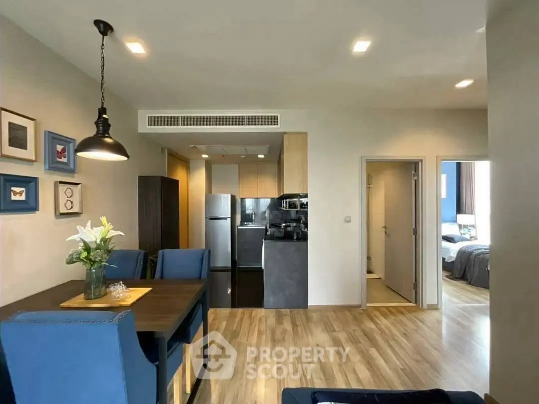 Modern open-plan living and dining area with stylish decor and natural light.