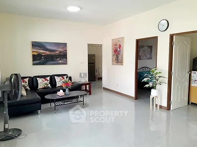 Spacious living room with modern decor and natural light