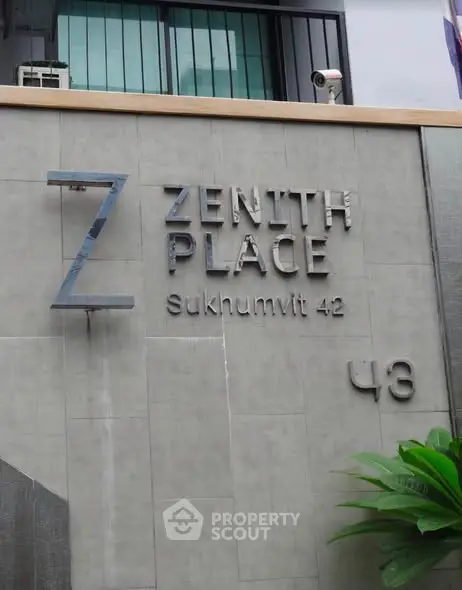 Modern building exterior with Zenith Place Sukhumvit 42 signage, showcasing urban living.